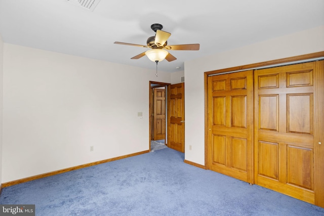 carpeted empty room with ceiling fan