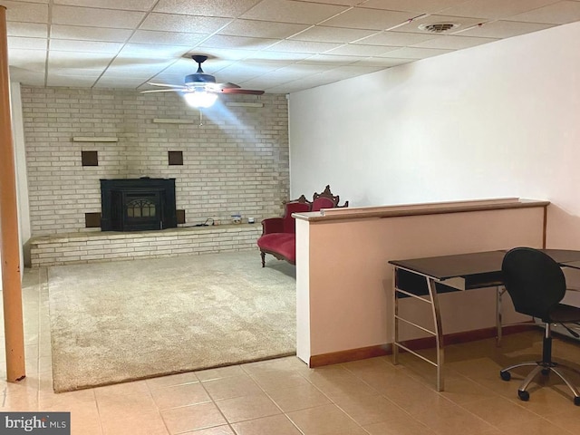 living room featuring a paneled ceiling, baseboard heating, and ceiling fan