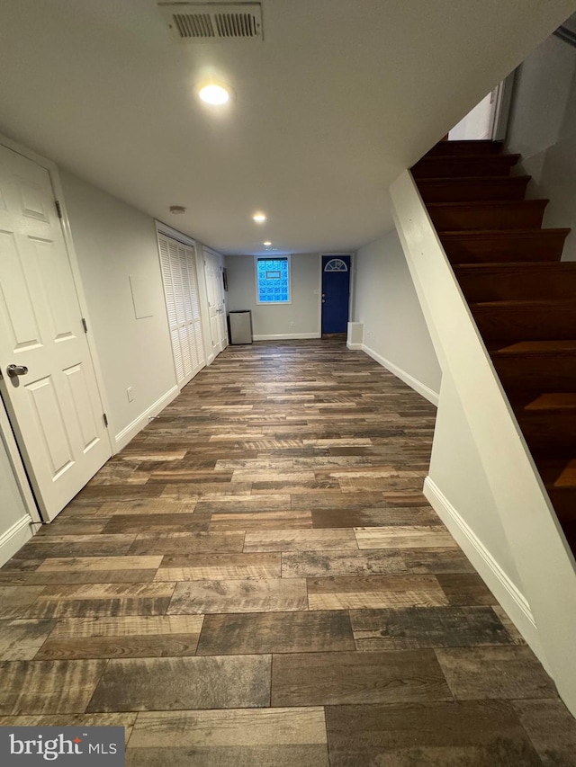 basement featuring dark wood-type flooring