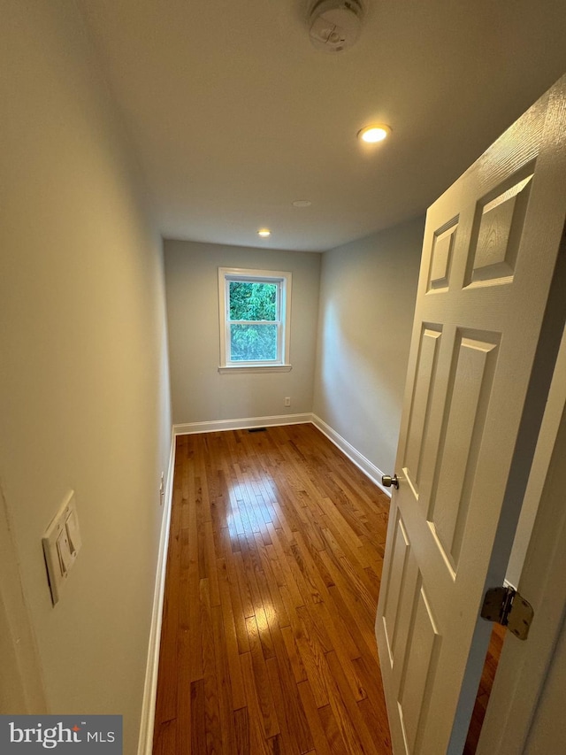 spare room with light hardwood / wood-style floors