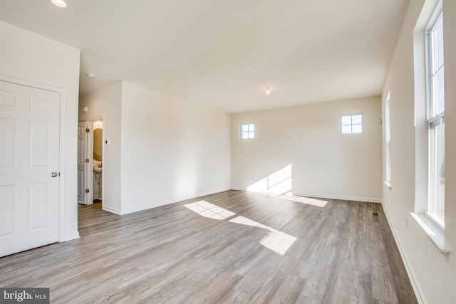 spare room with light wood-type flooring