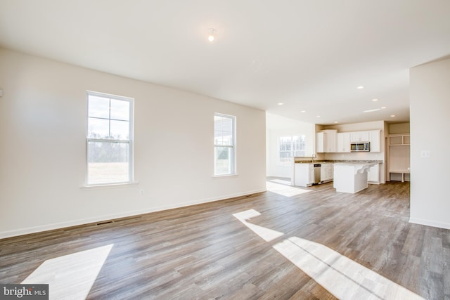 unfurnished living room featuring light hardwood / wood-style flooring