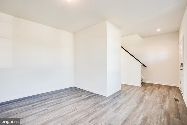 2107 Warrenton Rd, Fredericksburg, VA 22406 - spare room with wood finished floors, stairs, baseboards, and recessed lighting