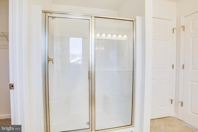 2107 Warrenton Rd, Fredericksburg, VA 22406 - full bath featuring a stall shower, a closet, and tile patterned flooring