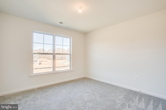 unfurnished room featuring carpet flooring