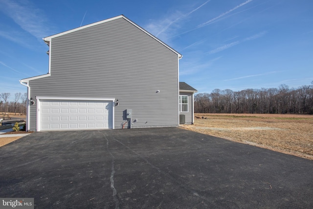 view of property exterior featuring a garage