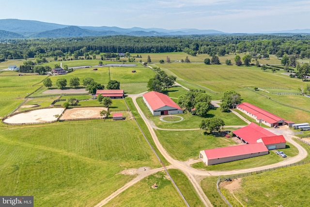 birds eye view of property featuring a mountain view and a rural view