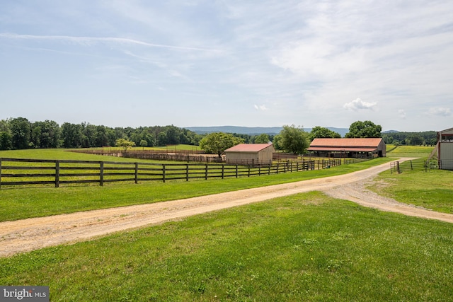 view of yard with a rural view