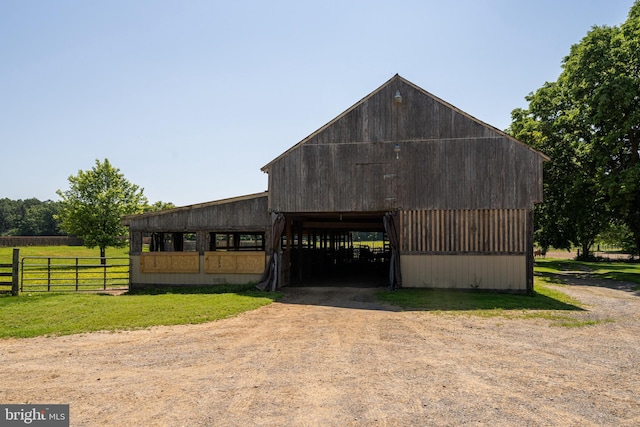 exterior space with a rural view and an outdoor structure