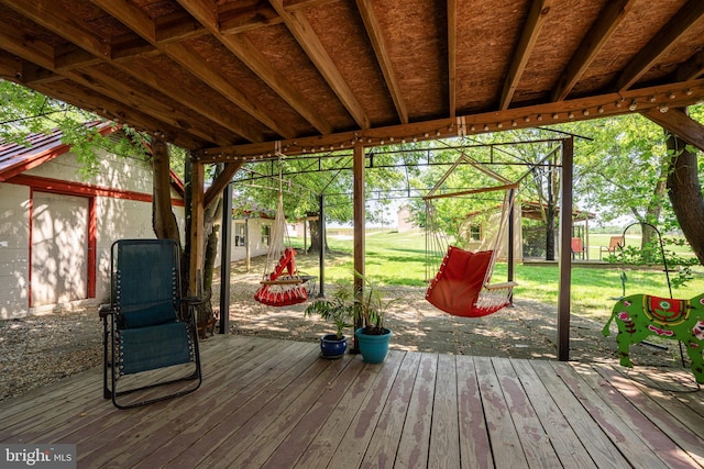 wooden deck featuring an outbuilding