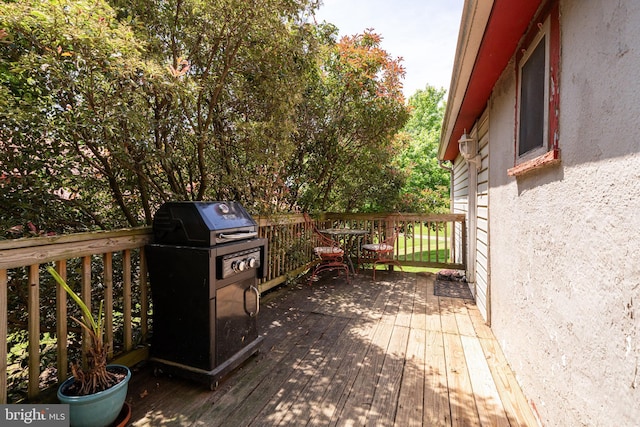 wooden deck with grilling area