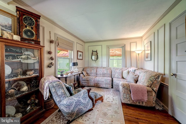 living room with crown molding and dark hardwood / wood-style flooring