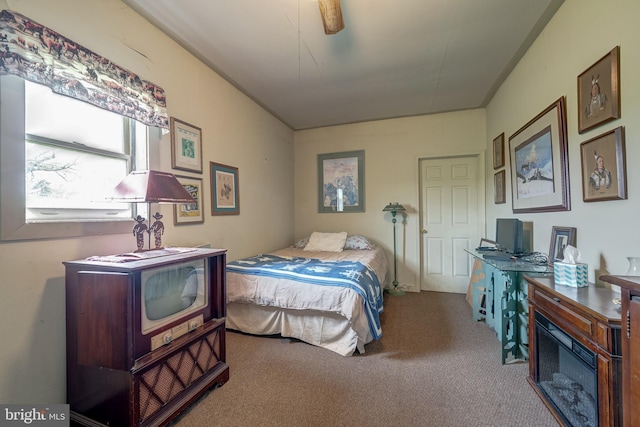 carpeted bedroom featuring ceiling fan