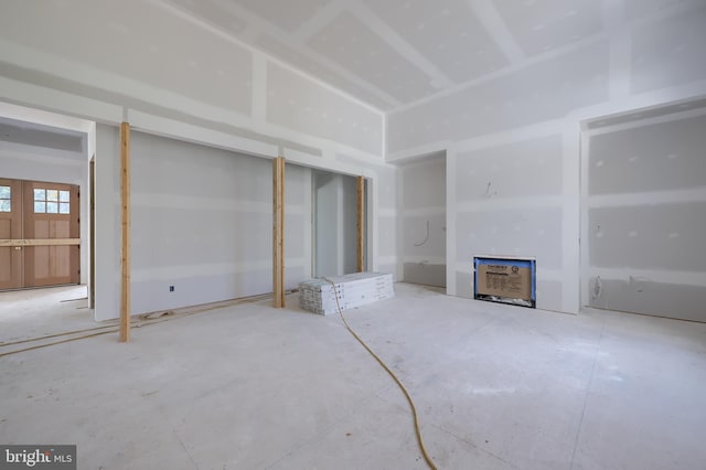 unfurnished living room featuring french doors