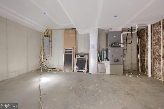 unfinished basement featuring electric panel