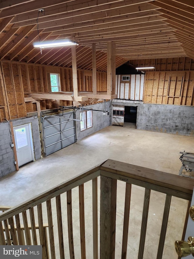 interior space with a healthy amount of sunlight and vaulted ceiling