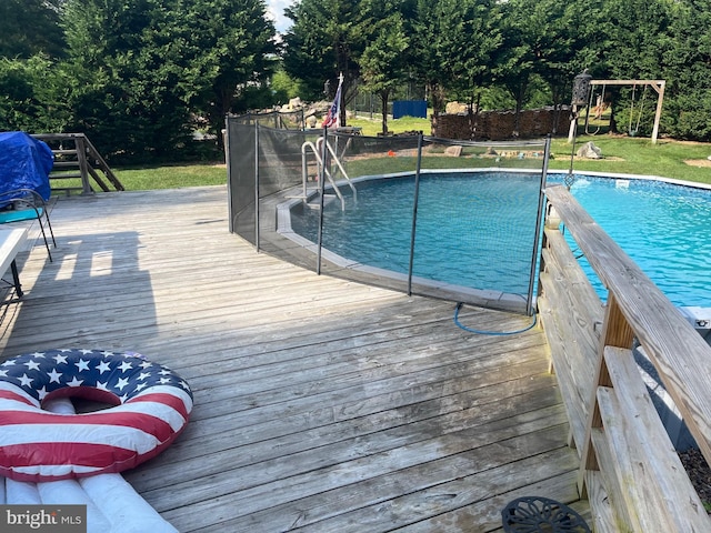 view of pool with a wooden deck