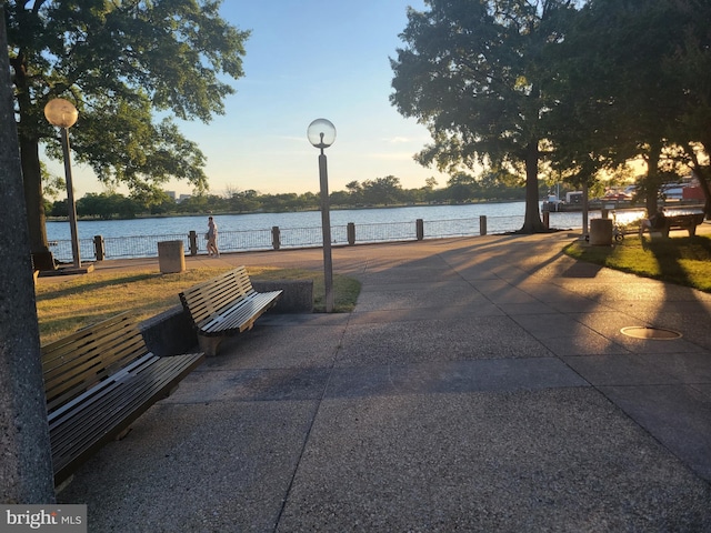 surrounding community featuring a water view