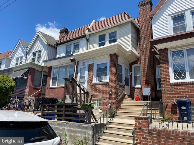 1979 73rd Ave, Philadelphia, PA 19138 - townhome / multi-family property with brick siding, cooling unit, and a residential view