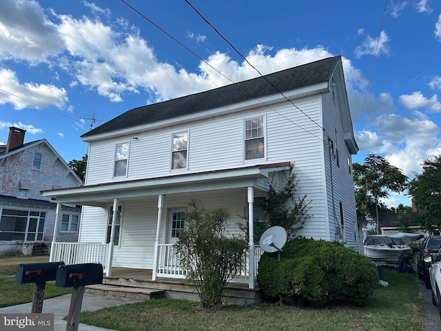 view of front of property featuring covered porch