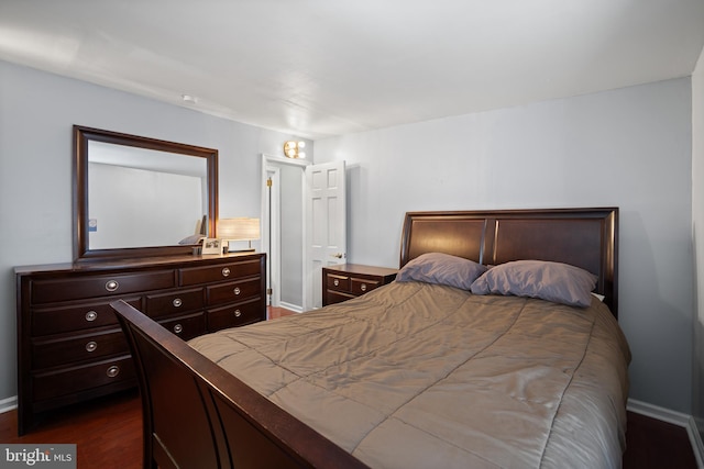 bedroom featuring dark hardwood / wood-style floors