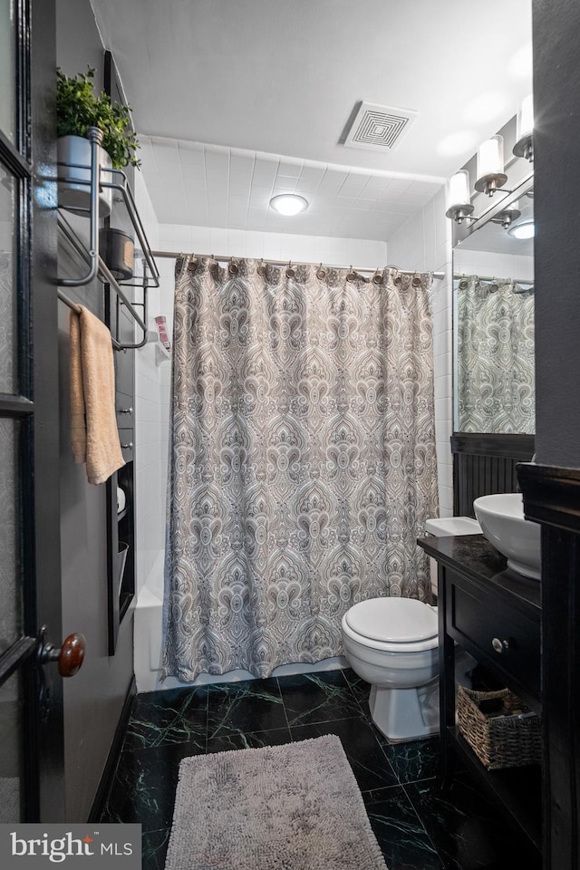 full bathroom with vanity, toilet, and shower / tub combo with curtain