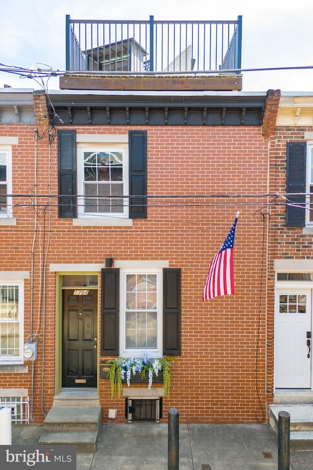 multi unit property featuring a balcony