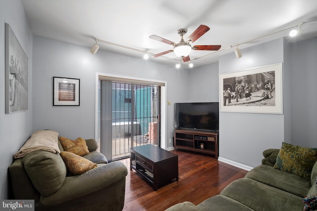 living room with dark hardwood / wood-style floors, ceiling fan, and track lighting