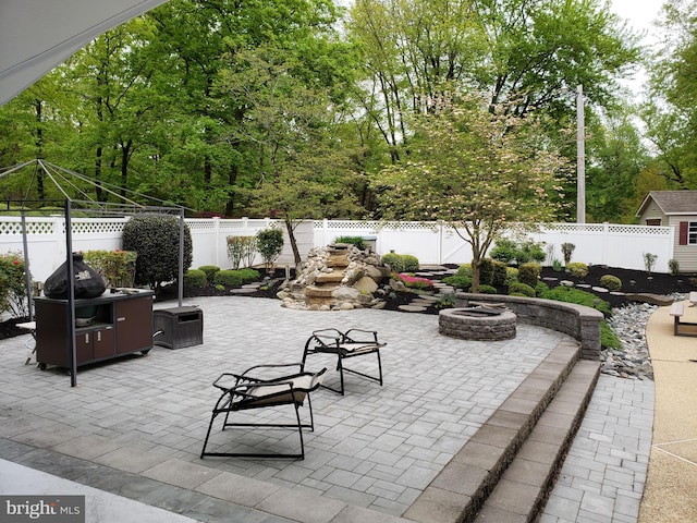 view of patio / terrace with a fire pit