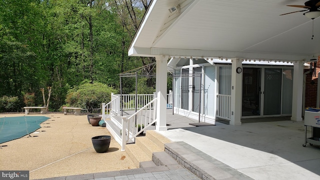 view of patio / terrace featuring a covered pool