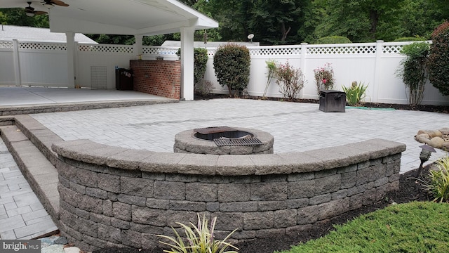 view of patio / terrace with a fire pit