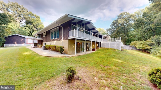 view of home's exterior with a garage, a yard, an outbuilding, and cooling unit