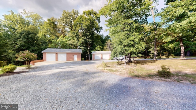 view of front facade with an outdoor structure and a garage