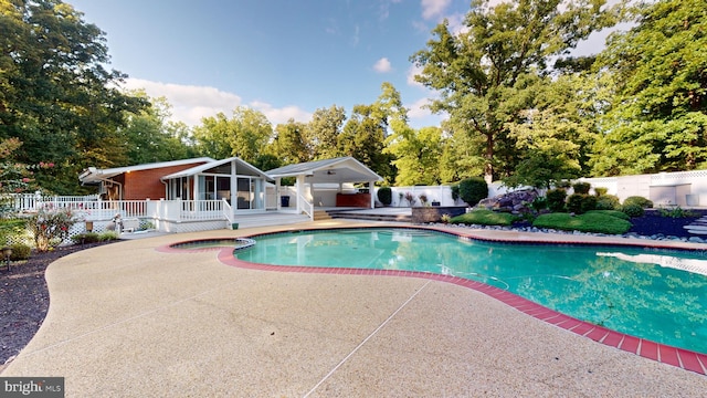 view of swimming pool with a patio area