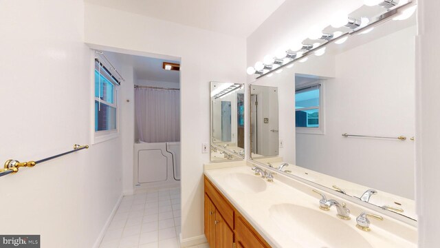 bathroom with tile patterned floors and vanity