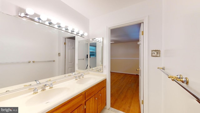 bathroom featuring vanity and wood-type flooring