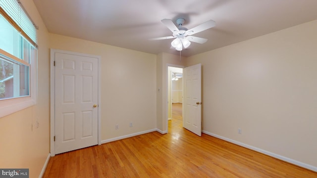 unfurnished bedroom featuring light hardwood / wood-style flooring and ceiling fan