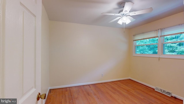 spare room featuring ceiling fan and light hardwood / wood-style flooring