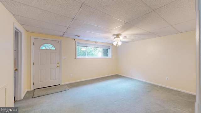 entryway featuring a paneled ceiling, ceiling fan, and carpet flooring