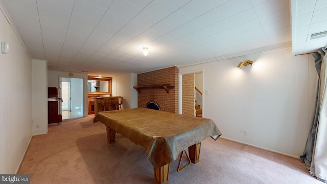 rec room with ornamental molding, a brick fireplace, pool table, and carpet floors