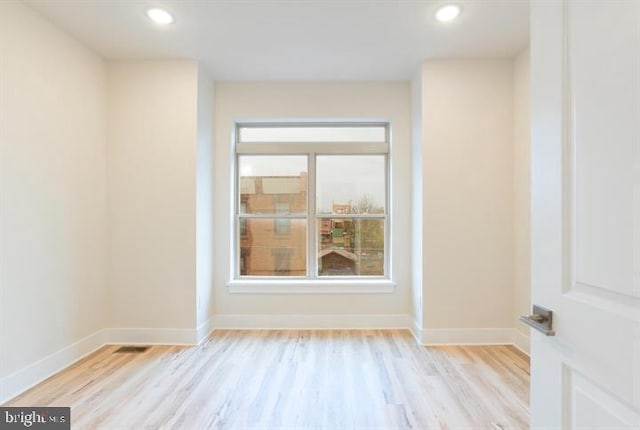 spare room with light hardwood / wood-style floors