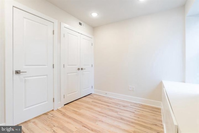 unfurnished bedroom with light hardwood / wood-style flooring