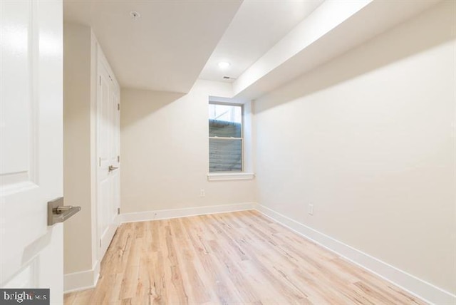 additional living space with light hardwood / wood-style flooring