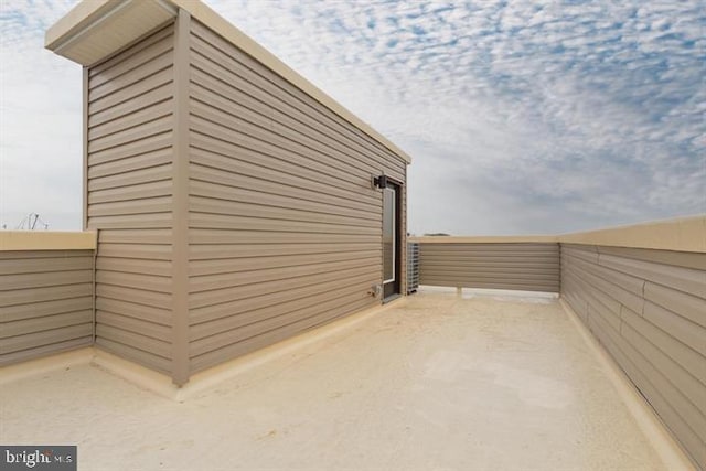 view of property exterior featuring a balcony