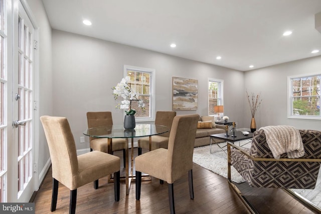 dining space featuring french doors, dark hardwood / wood-style floors, and a wealth of natural light