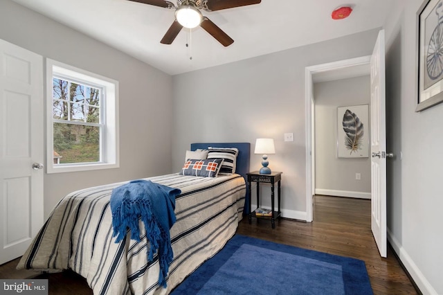 bedroom featuring ceiling fan and dark wood-type flooring