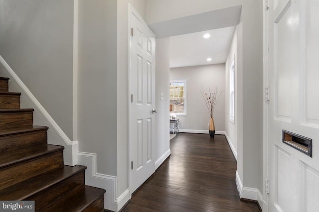 corridor featuring dark wood-type flooring