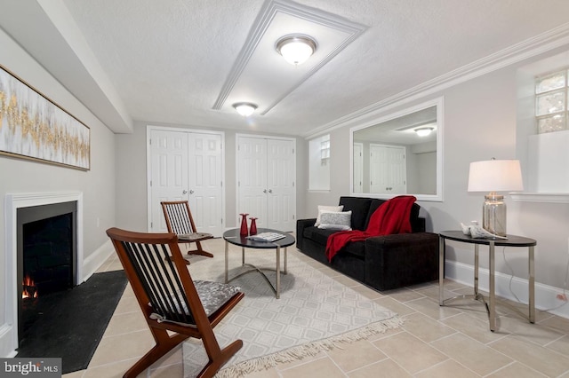 tiled living room featuring crown molding and a textured ceiling