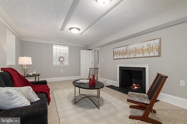 living room with light tile patterned flooring, a textured ceiling, and ornamental molding