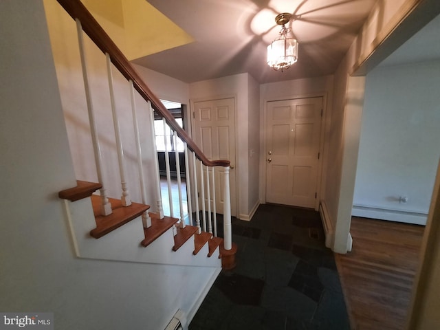 foyer entrance with baseboard heating